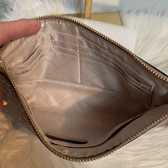Authentic soft pink patent leather large wristlet clutch by Michael Kors